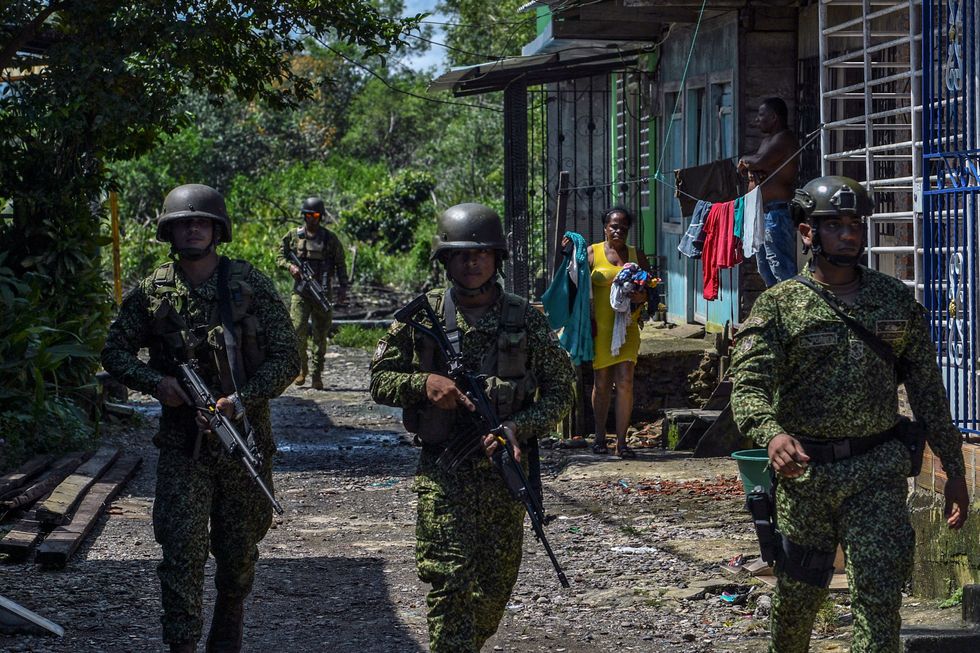 Navy soldiers patrol a street in the port city of Buenaventura, Valle del Cauca Department, Colombia