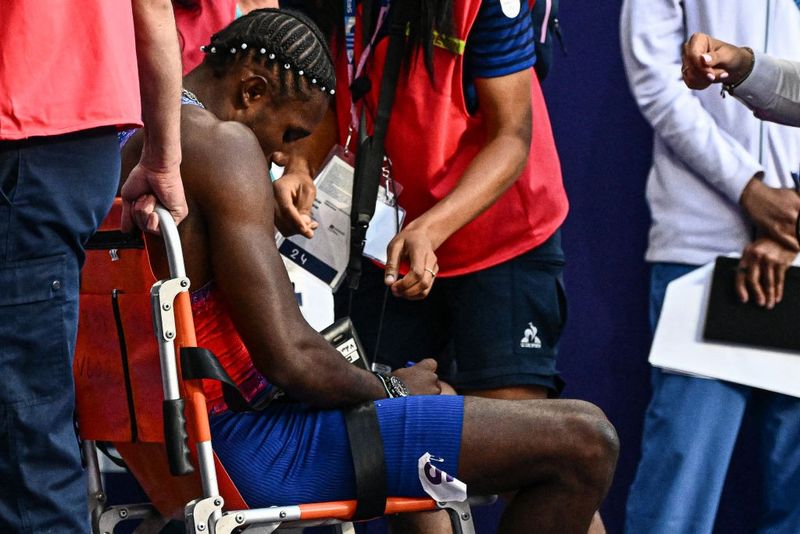 Noah Lyles: Olympic champion COLLAPSES on track after dramatic 200m final