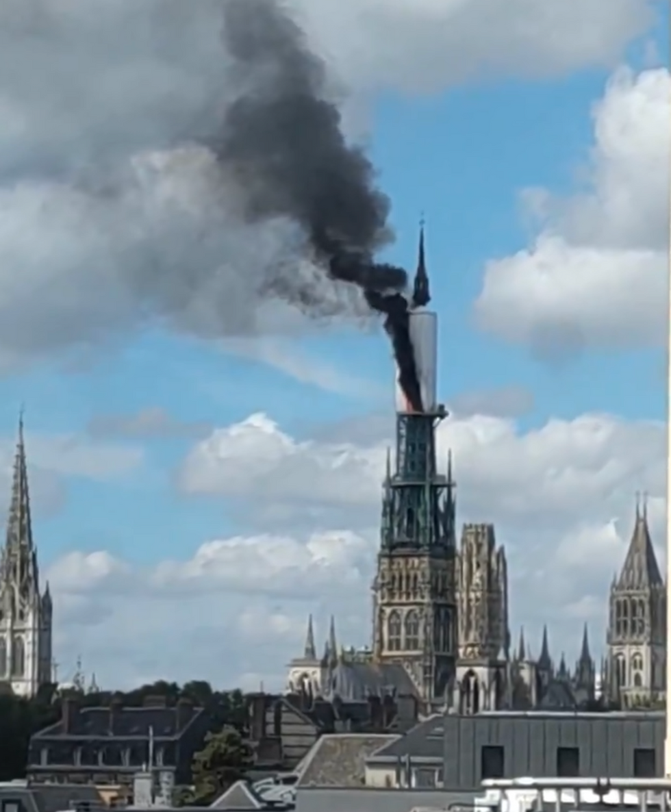 Notre Dame Cathedral in Rouen on fire as black smoke engulfs spire