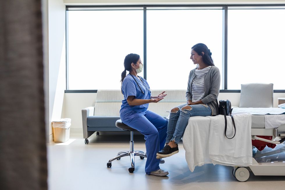 Nurse speaking to patient