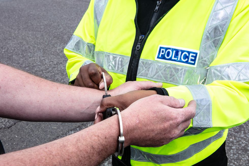 Officer arresting individual