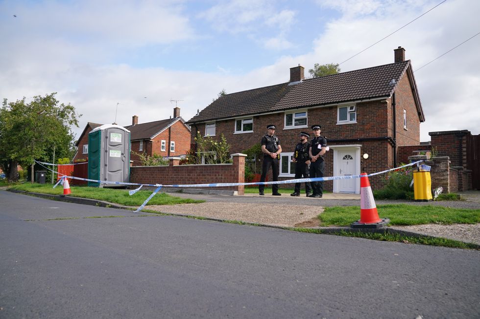 Officers outside Sharif's home