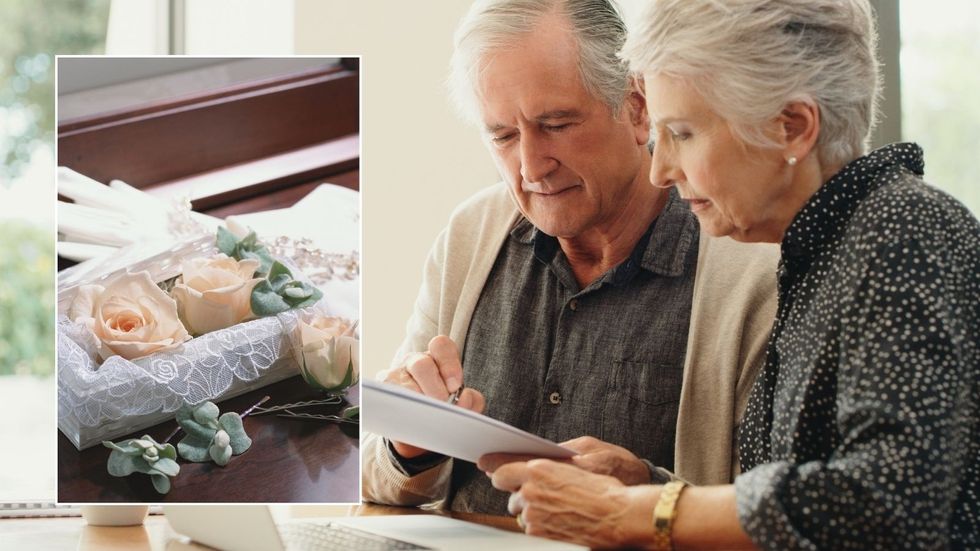 Older couple and funeral casket 