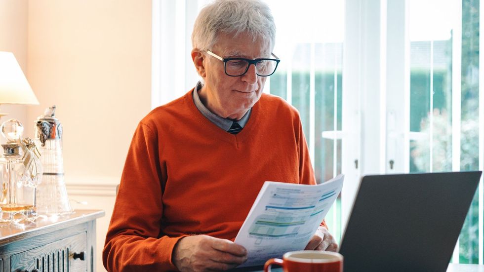 Older man reading letters