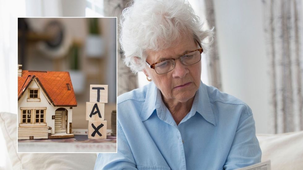 Older woman and tax sign 