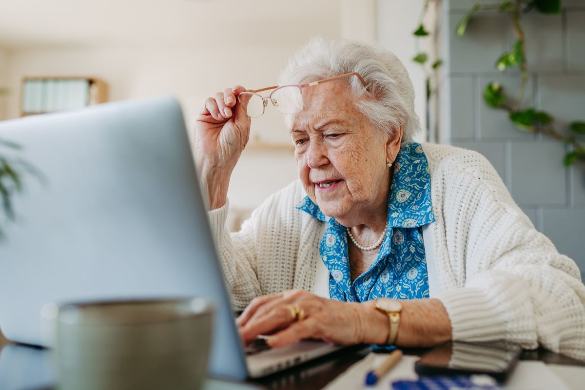 Older woman looking at laptop 