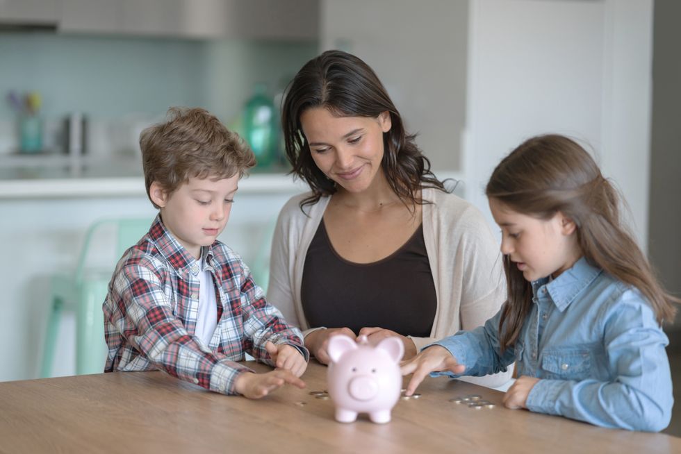 Parent and two children save money in pictures