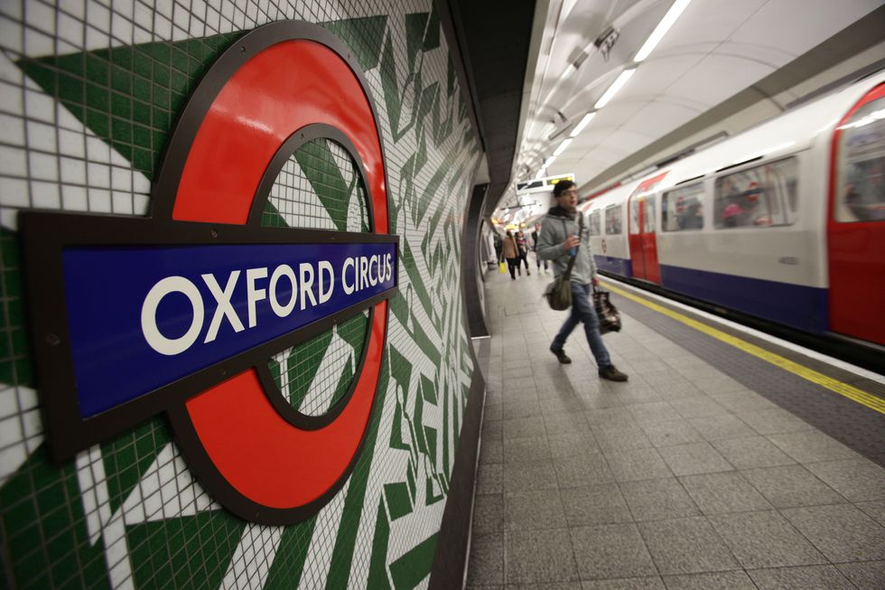 Passengers at a platform at Oxford Circus Underground station in London