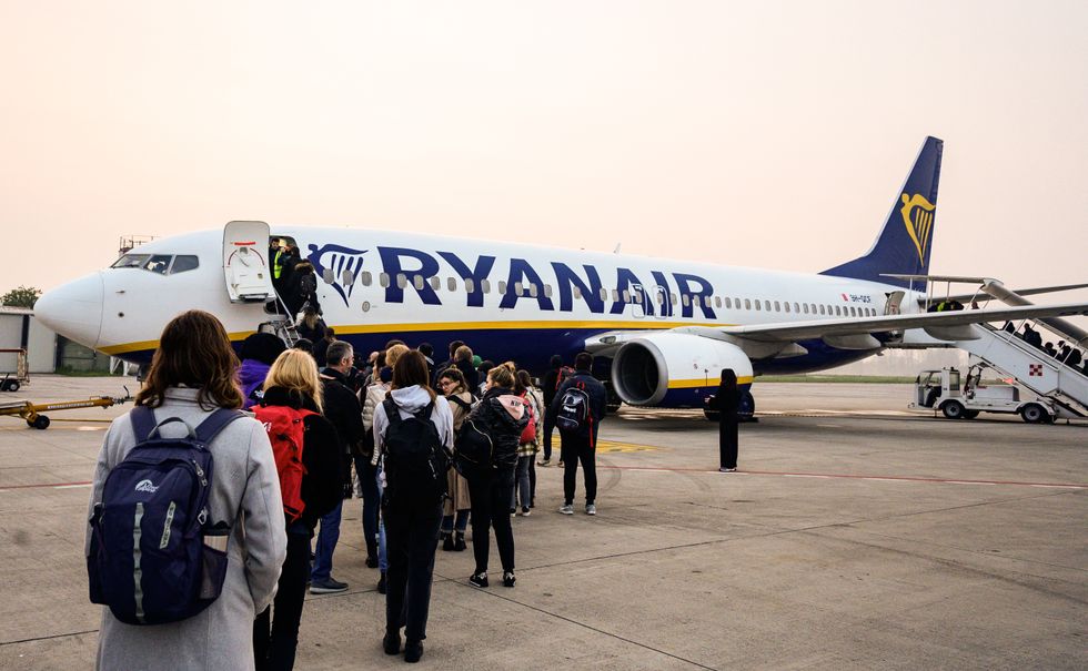 Passengers waiting to board a Ryanair flight