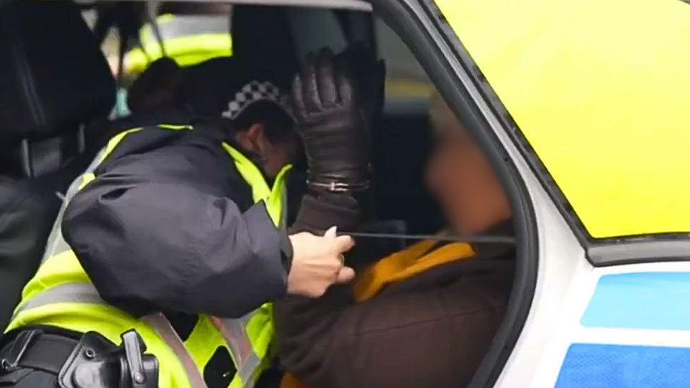 Pensioner in handcuffs