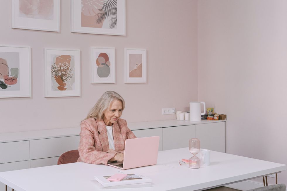 Pensioner looking at a laptop