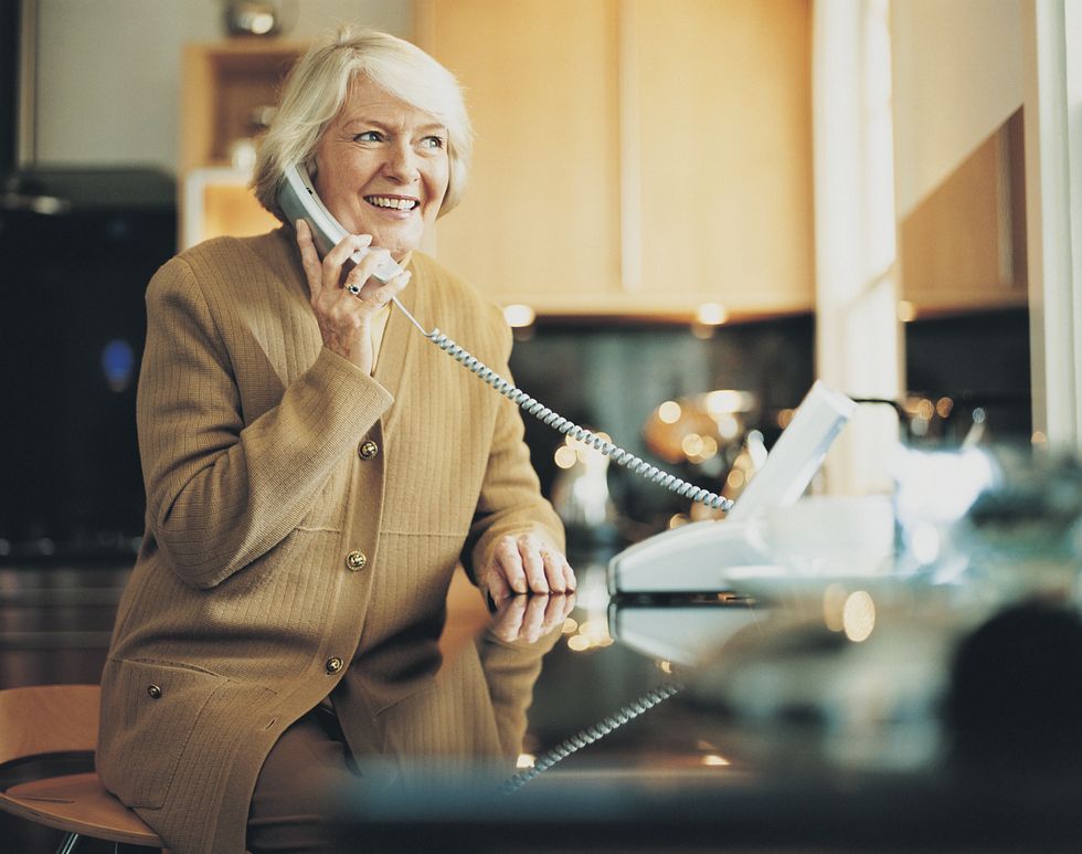 Pensioner on telephone