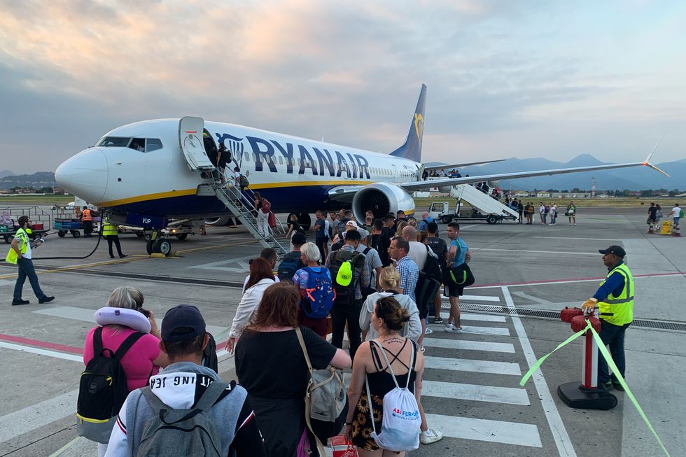 People board Ryanair plane at the airport in Bergamo, Italy on September 4, 2023