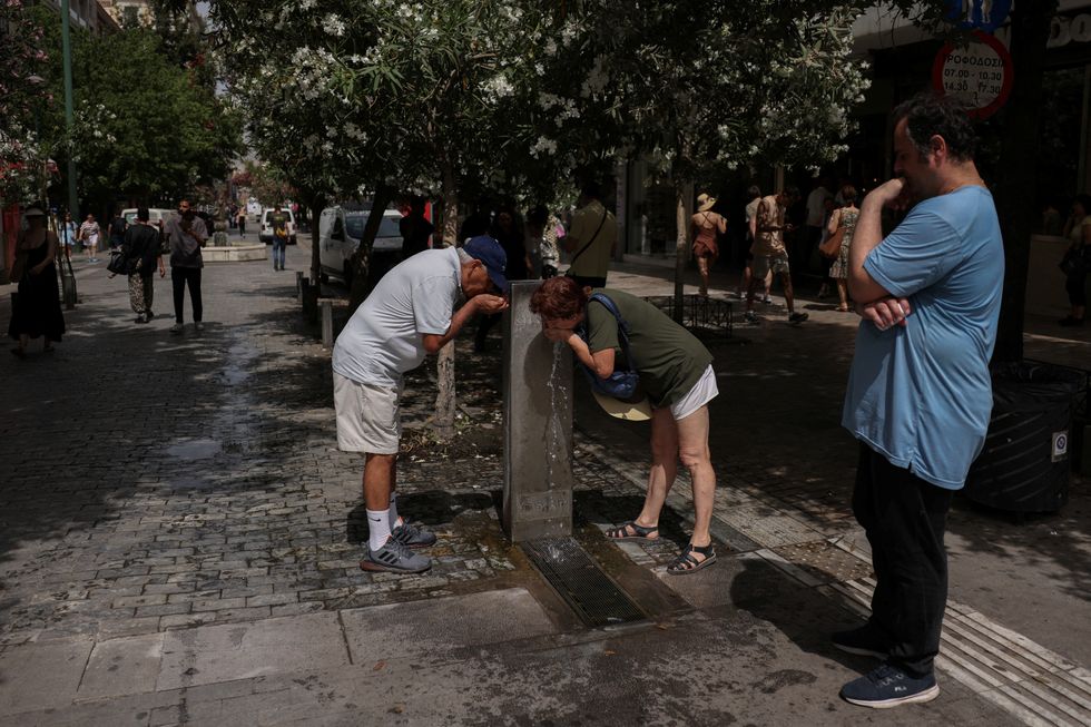 People drinking from taps in Greece