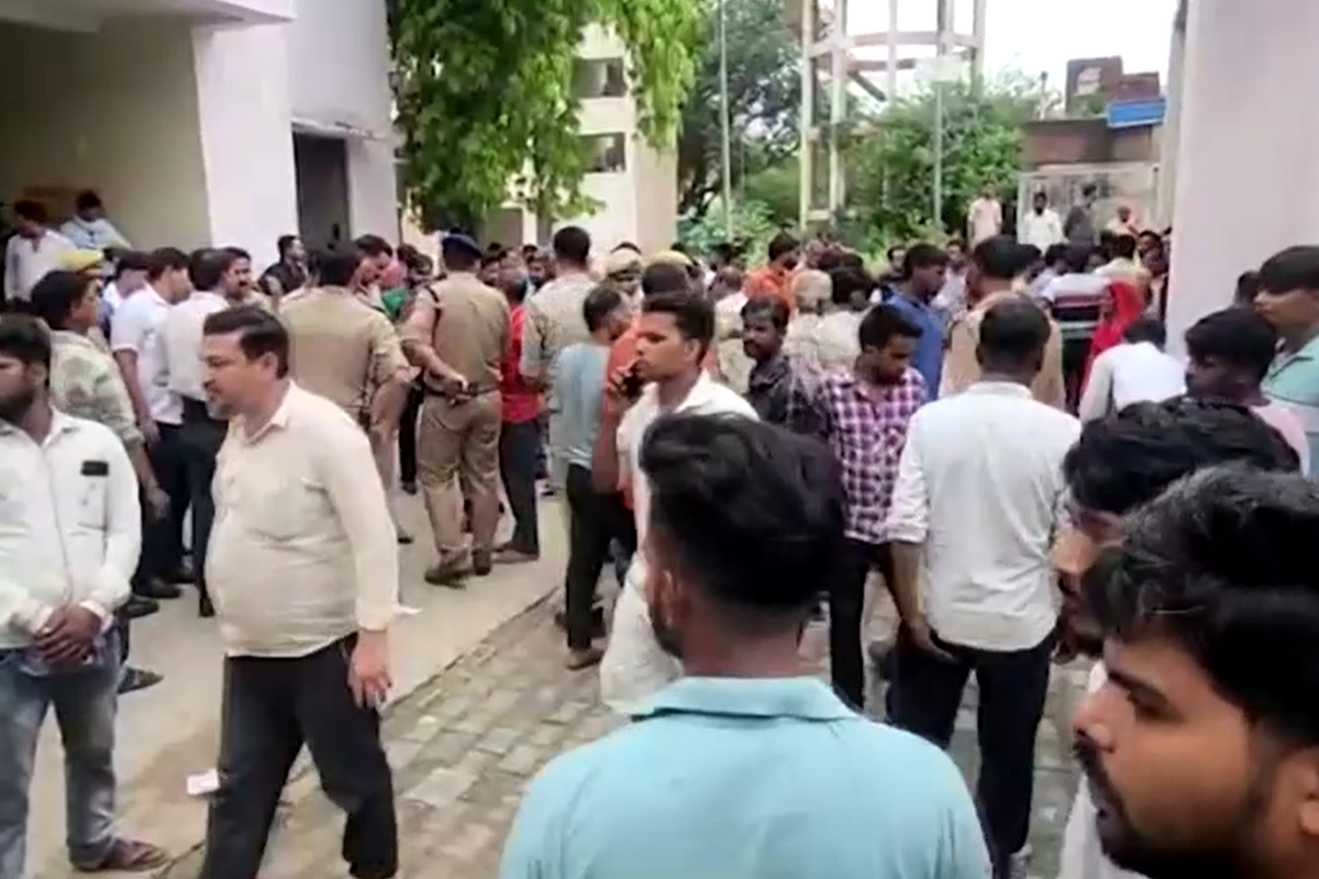 ​People gather outside the local hospital.