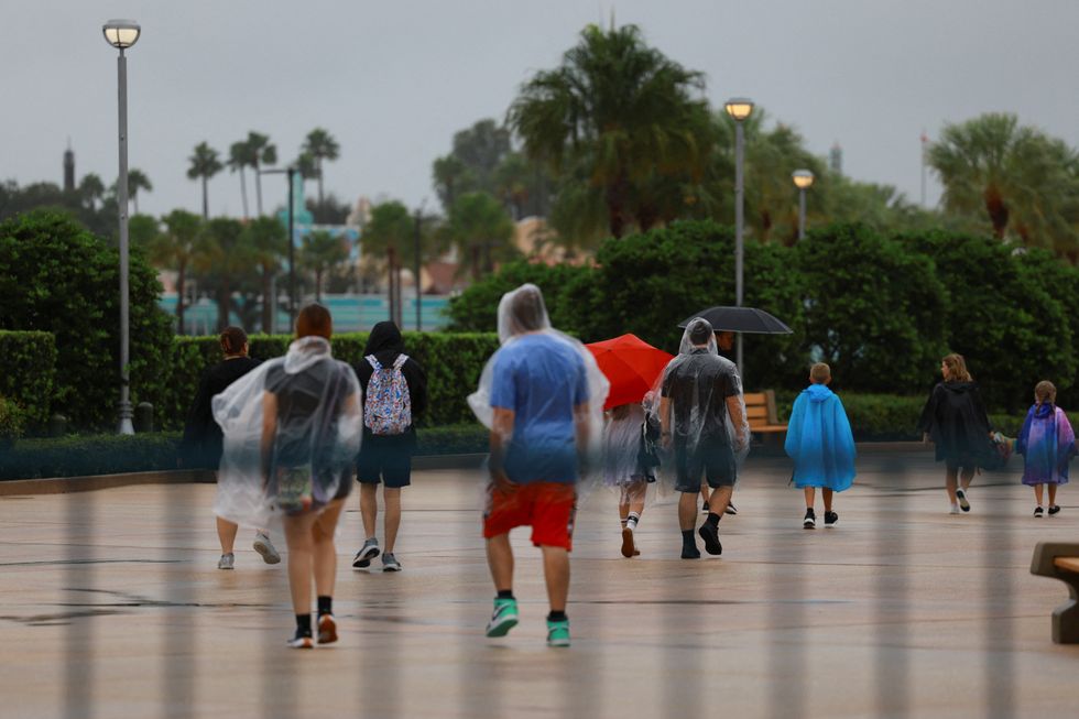 People in ponchos at u200bDisney World in Florida