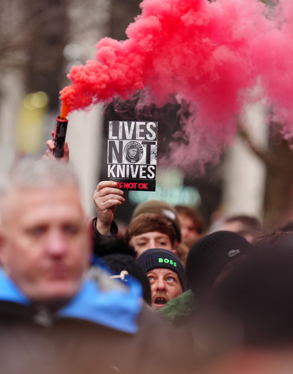 People marching in memory of Harvey Willgoose