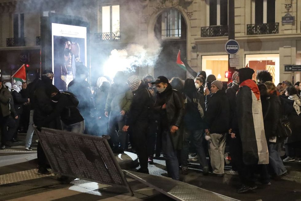 People take part in a protest against the controversial gala organized by the association 'Israel Forever' in Paris, France