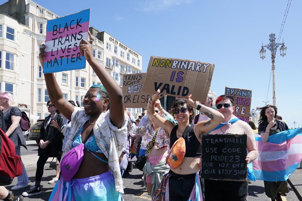 People take part in a Trans Pride protest march in Brighton on Saturday July 15, 2023.