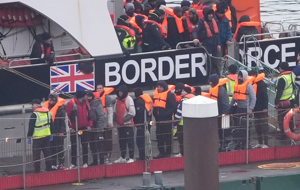 People thought to be migrants are brought in to Dover, Kent, from a Border Force vessel