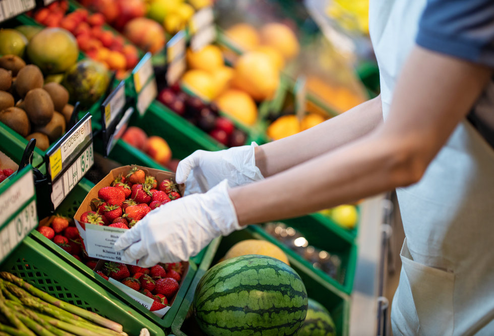 PERSON HANDLING FRUIT