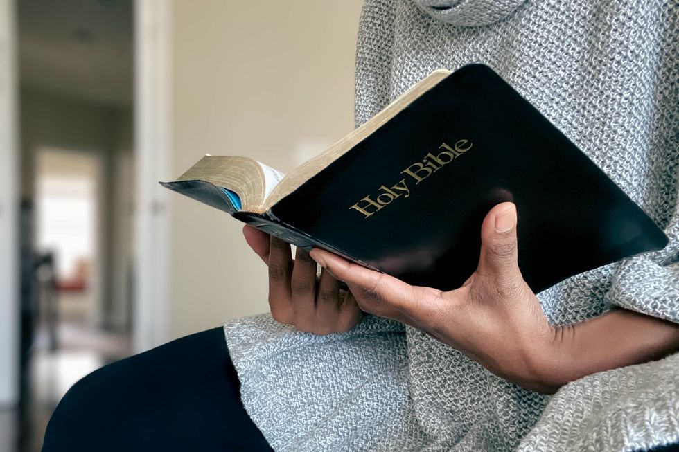 Person reading bible