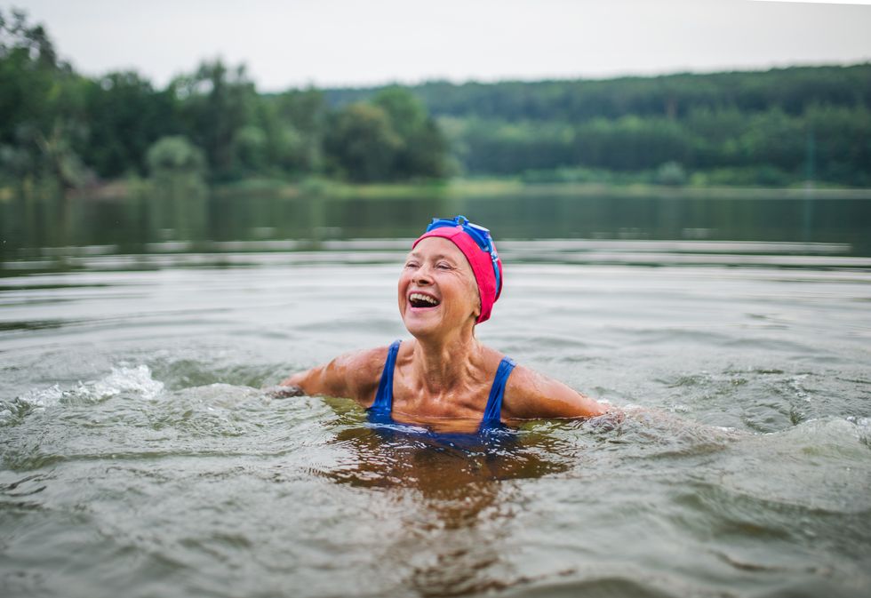 PERSON SWIMMING IN LAKE