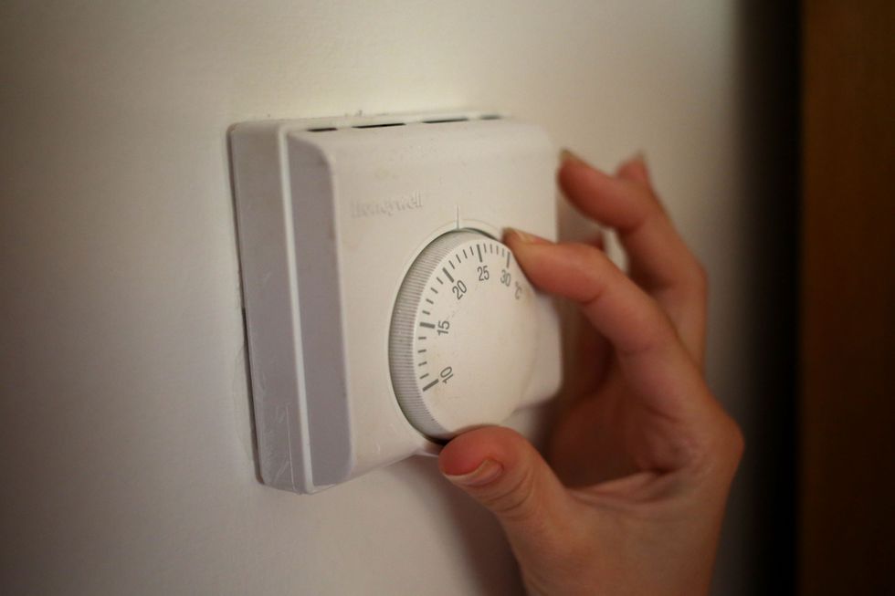 Person uses thermostat