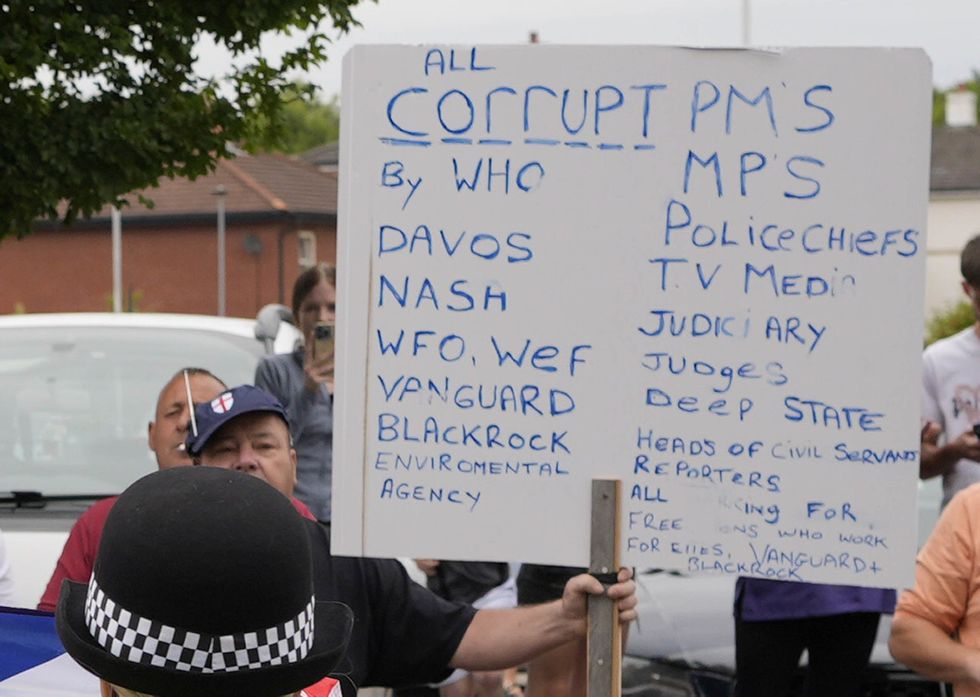 Peter Lynch holding placard