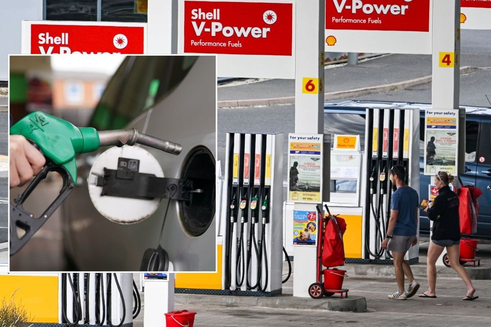 Petrol pump and people walking at a filling station