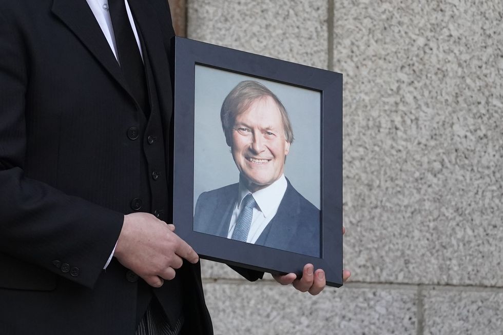 Photo of Sir David Amess being carried into Westminster Cathedral