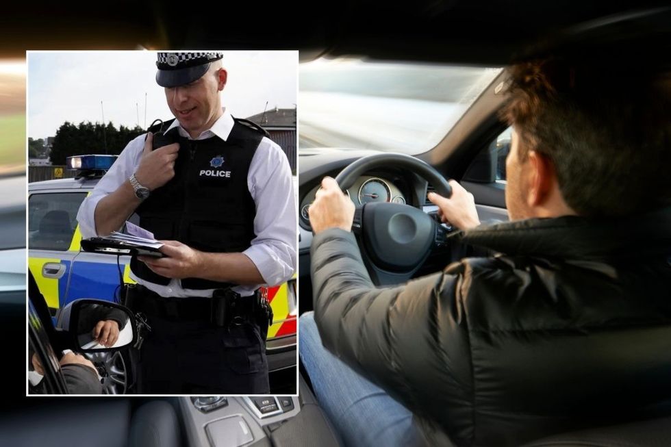 Police officer pulling a car over and a man driving