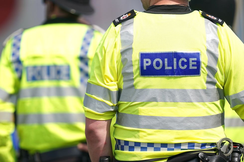 Police officers during Derby Day of the 2023 Derby Festival at Epsom Downs Racecourse