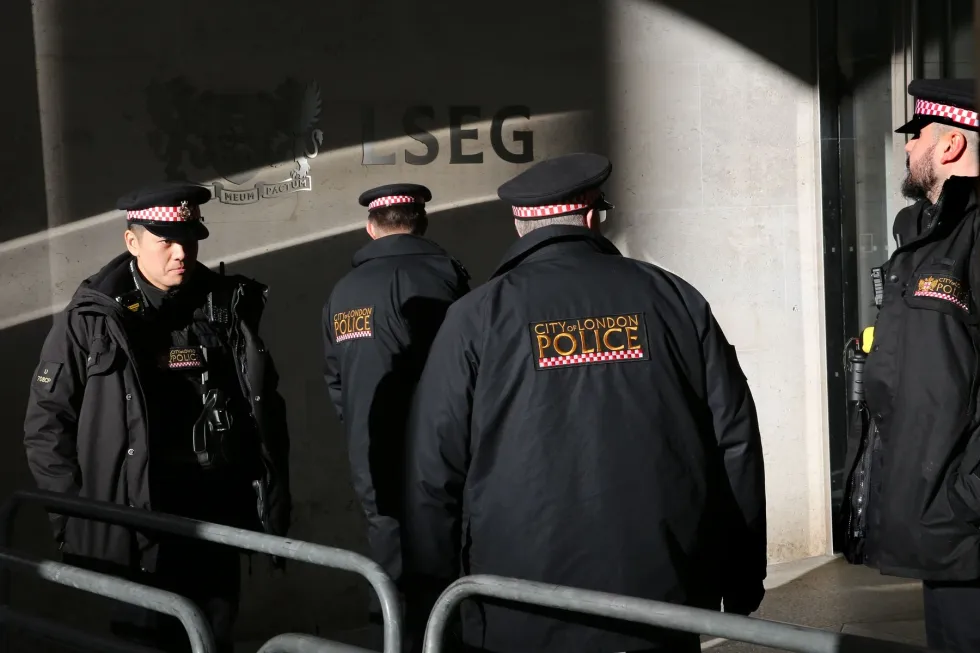 police officers from the Police Intellectual Property Crime Unit standing outside