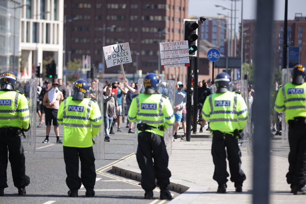 Police officers near protesters