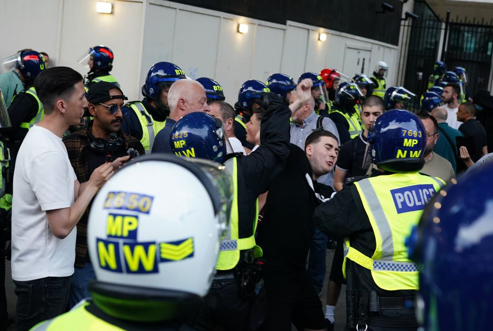 Police officers scuffle