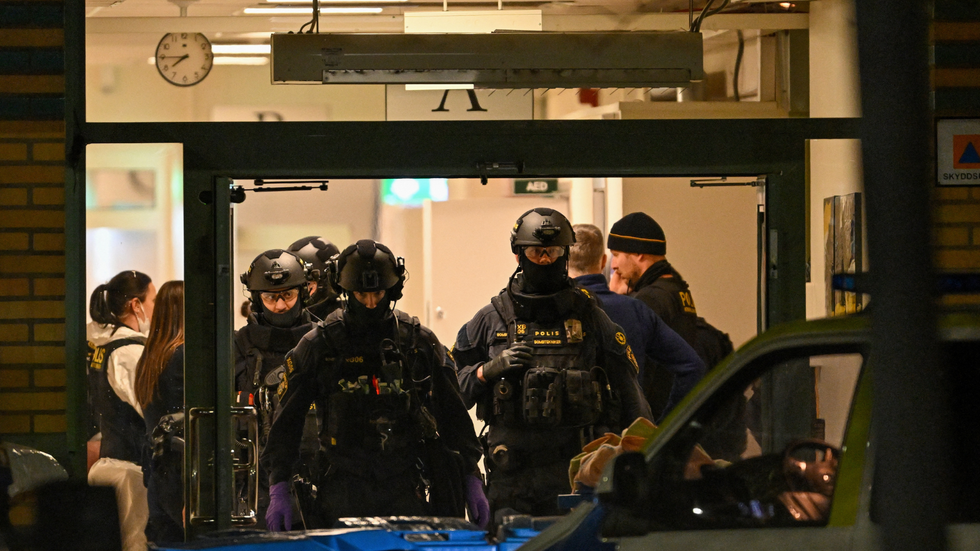 Police officers work at the scene of the Risbergska School in Orebro, Sweden