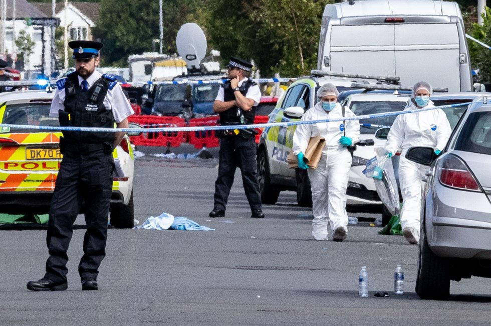 Police on Hart Street Southport, Merseyside, following the attack