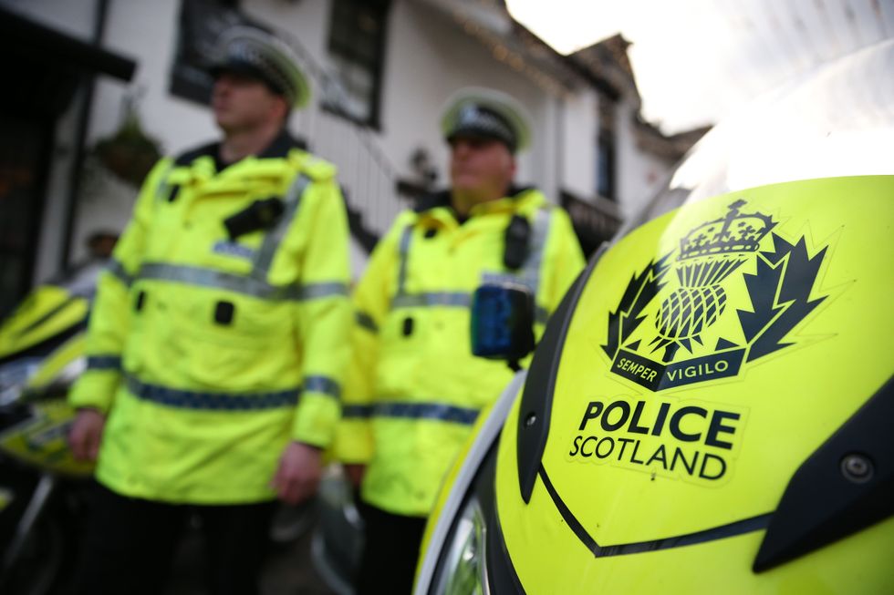 Police Scotland officers and motorcycle