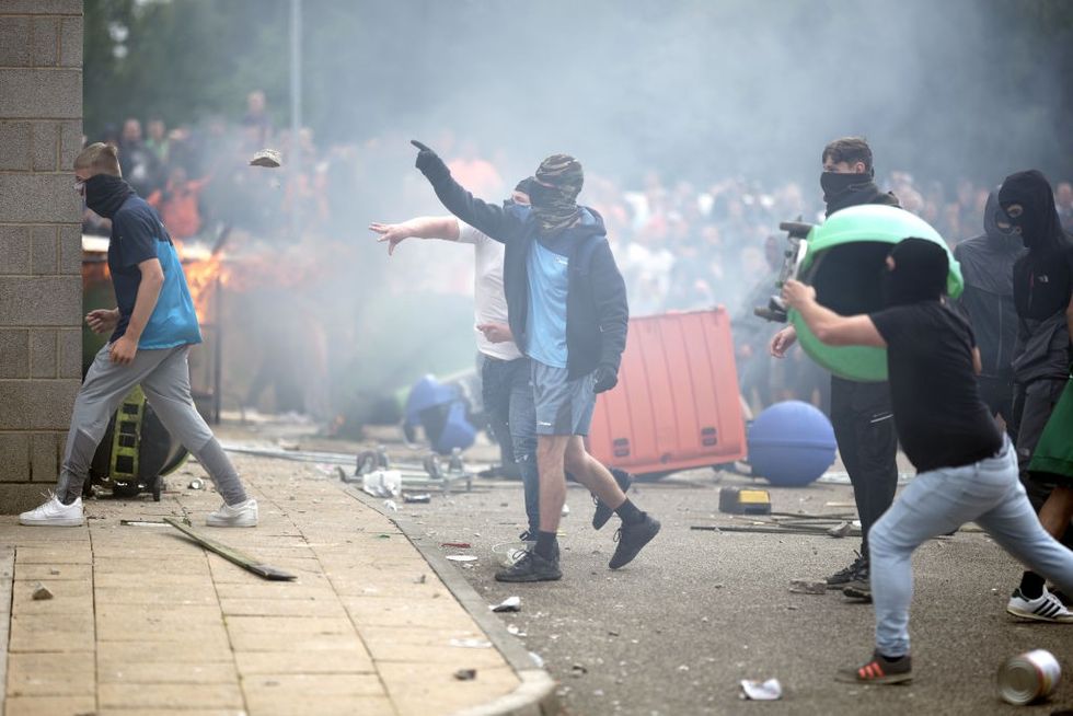 Police were hit with petrol bombs and bricks during the riots