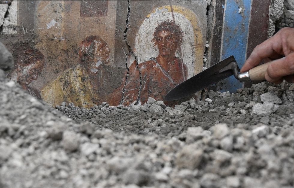 Pompeii fresco and trowel digging