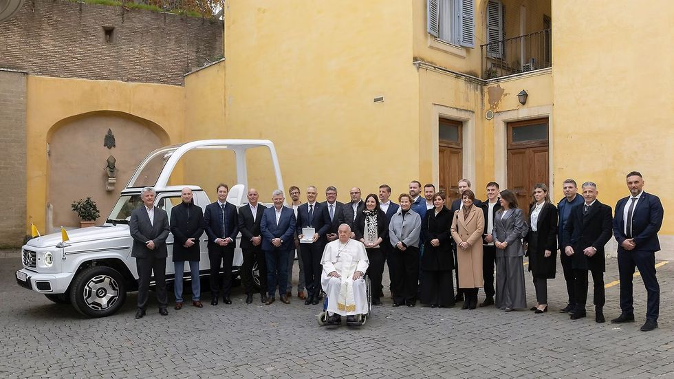 Pope Francis with the Mercedes-Benz Popemobile