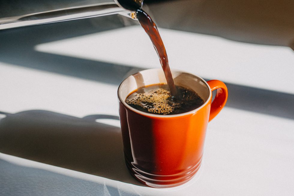 Pouring coffee into a cup