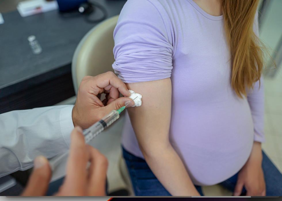 Pregnant woman getting vaccinated