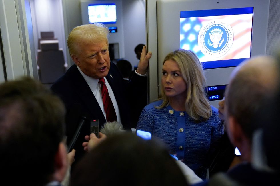 president donald j trump speaking to the press on Air Force One