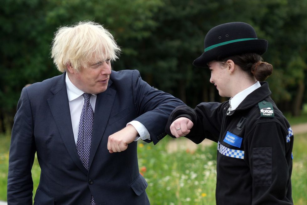 Prime Minister Boris Johnson greets a police officer with his elbow as he attends the unveiling of the UK Police Memorial at the National Memorial Arboretum at Alrewas, Staffordshire