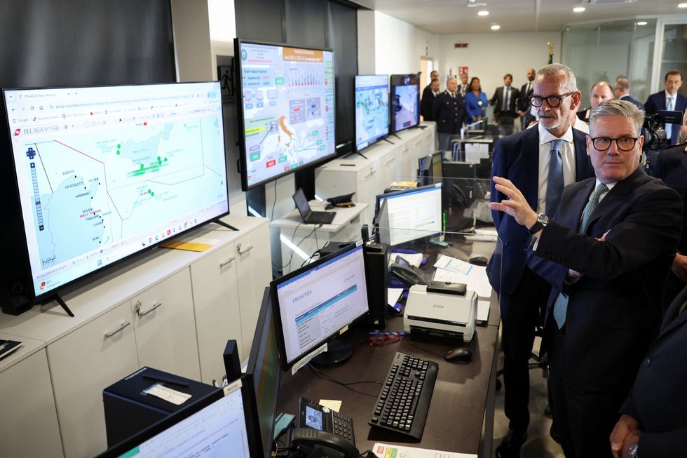 Prime Minister Sir Keir Starmer looks at screens showing the maritime traffic off the Italian coast during his visit to the National Coordination Centre in Rome, Italy.