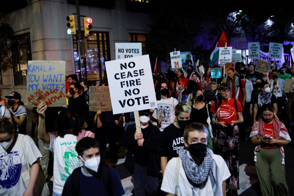 Pro-Palestinian protesters gather outside debate venue