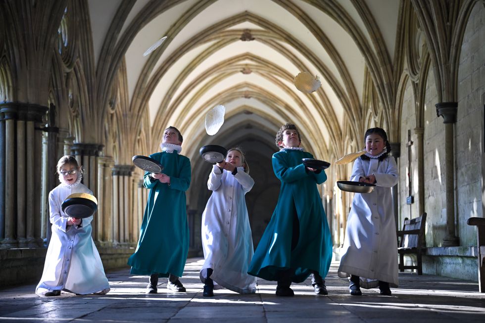 Probationer Choristers of the Salisbury Cathedral Choir practice tossing pancakes ahead of Shrove Tuesday, at Salisbury Cathedral