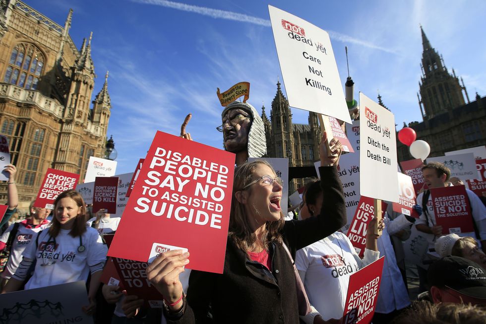 Protesters outside the Houses of Parliament in London as MPs debate and vote on the Assisted Dying Bill